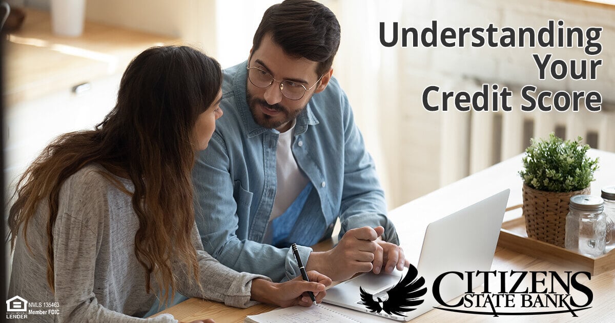 Couple reviewing paperwork - Understanding Your Credit Score